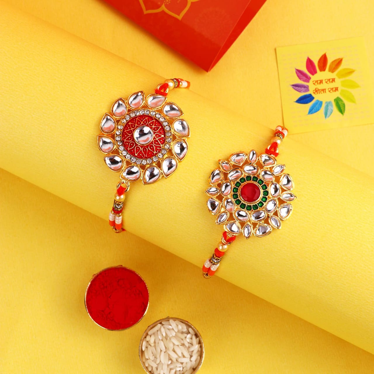 "Royal Kundan Rakhi Duo – Radiance of Tradition"